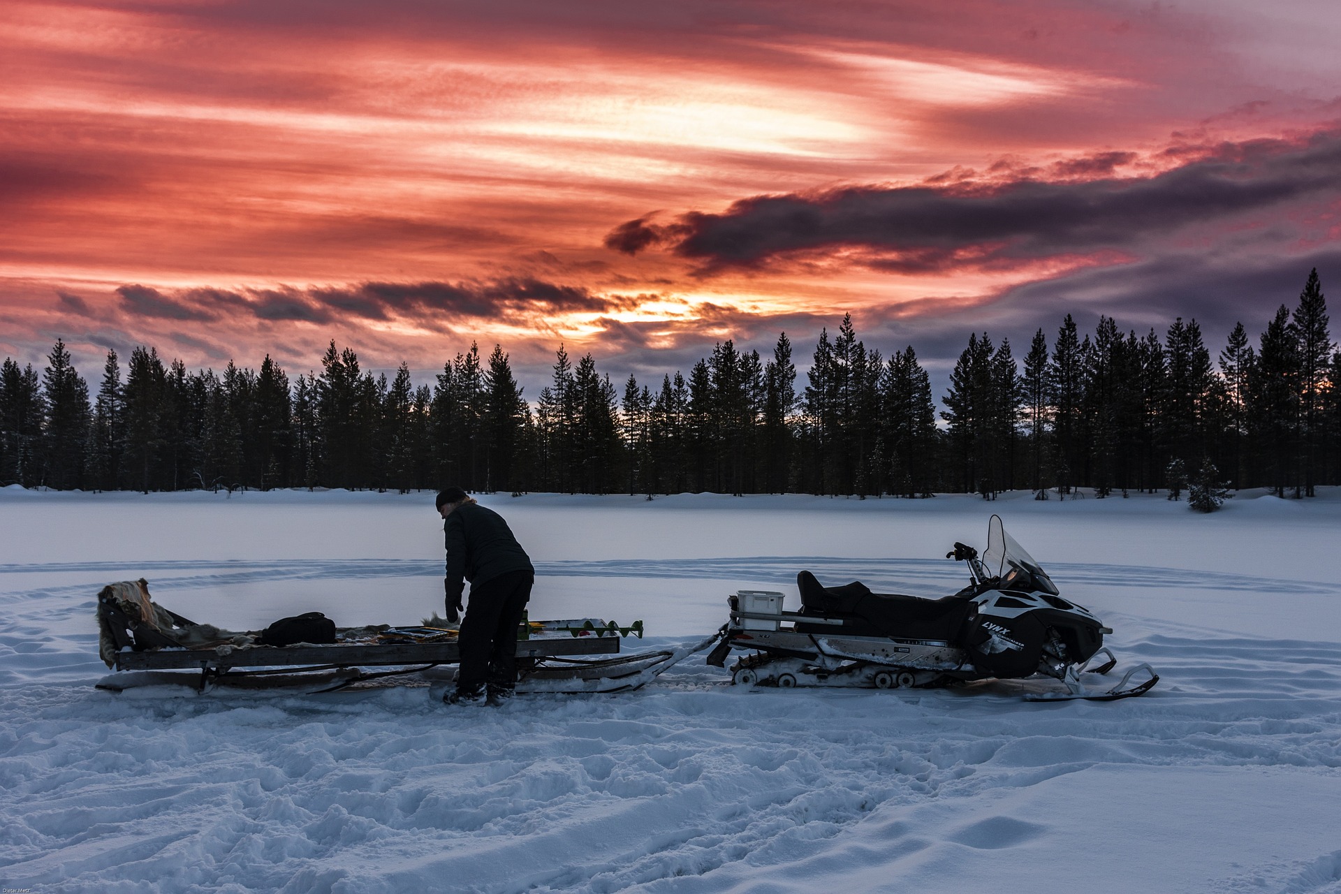 lapland scenary landscape snowmobile sun set