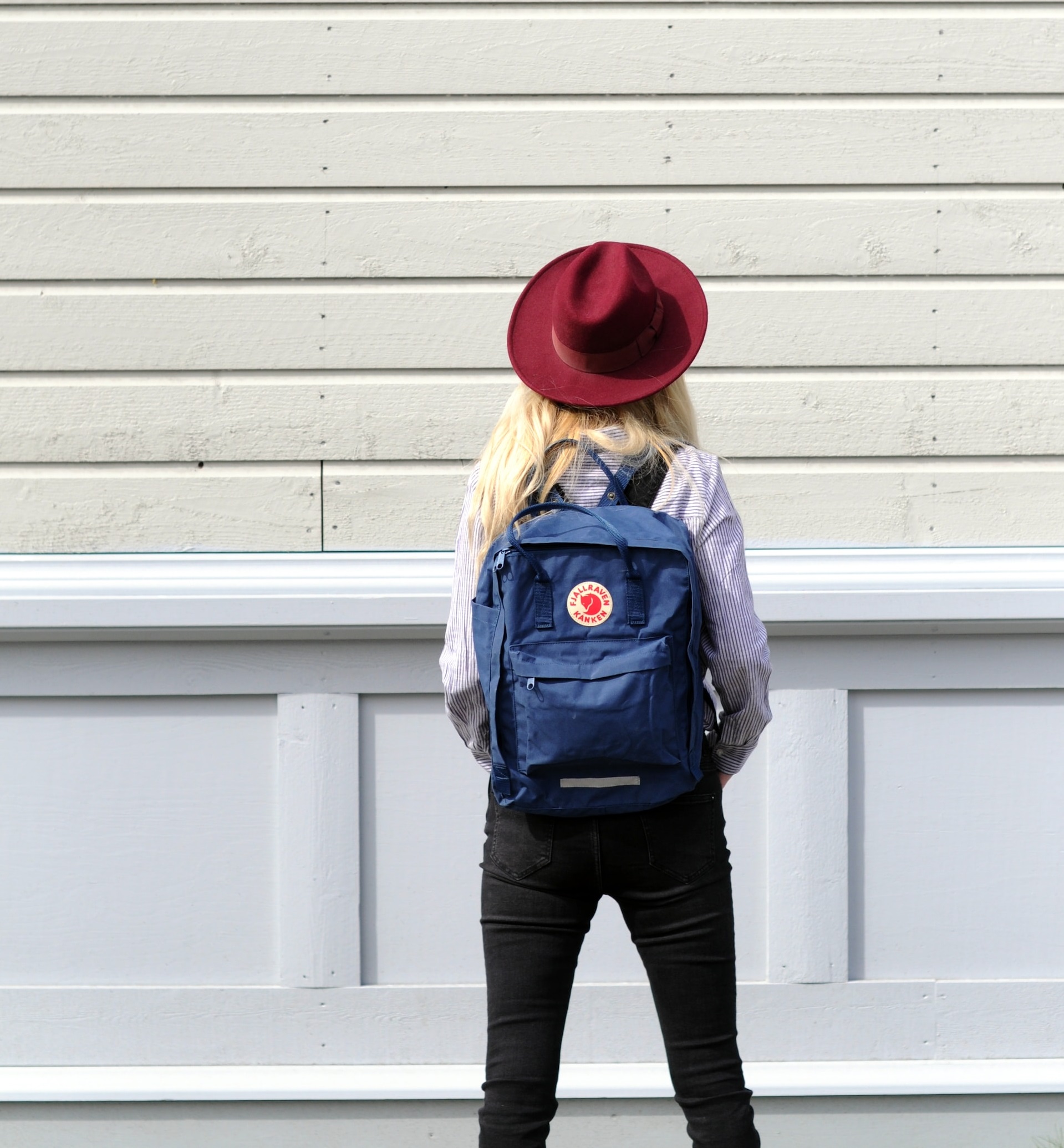 Swedish Culture vs American Culture girl standing facing white wall