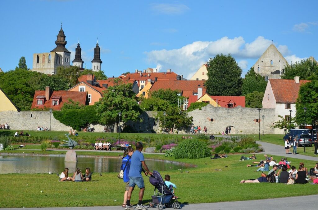 visby sweden gotland old houses church pond family