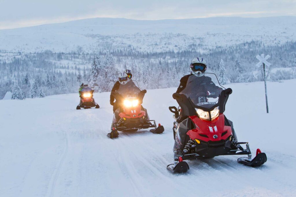 snowmobile mountains red